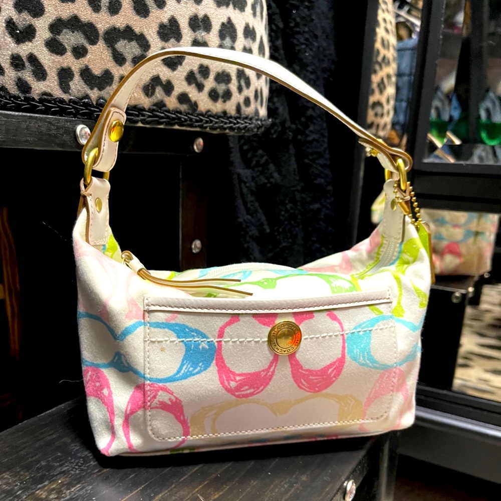 Coach clutch Hand Bag. Seasonal pastel pattern.
